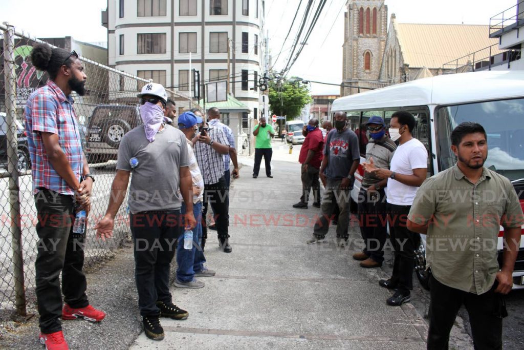 Route 2 maxi taxi drivers protest in fron the Ministry of Works and Transport, Richmond Street in Port of Spain on Monday.   PHOTO BY ANGELO M MARCELLE - 