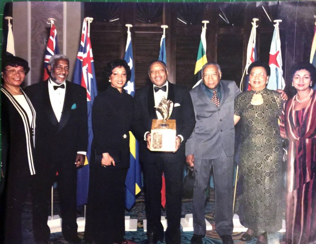 William Aguiton with his family receiving the Hotelier of the Year award in The Bahamas in June 1999