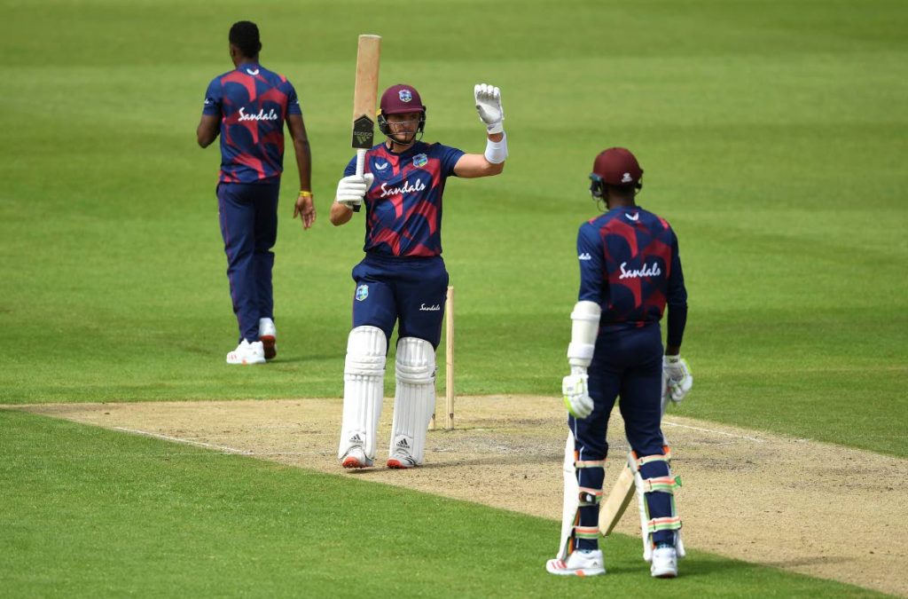 West Indies Joshua Da Silva celebrates reaching his century during day three of a West Indies warm up match at Old Trafford in Manchester, England, on Wednesday.  England are scheduled to play West Indies in their first international Test match on July 8-12. via AP - Gareth Copley