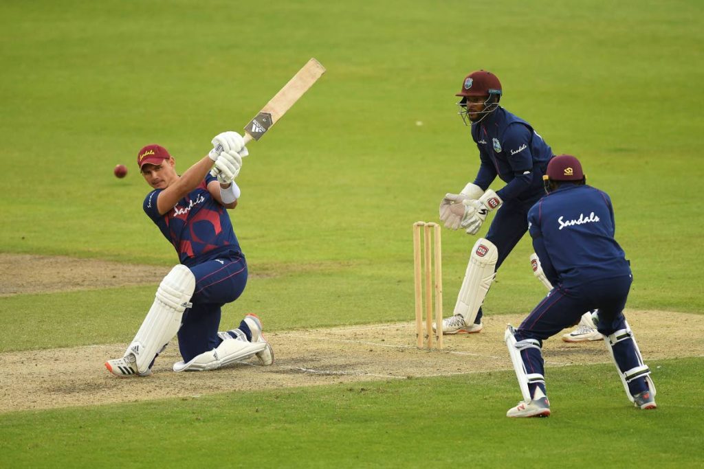 West Indies’ Joshua Da Silva of the West Indies bats watched by Shai Hope and Shamarh Brooks during day four of a West Indies warm-up match at Old Trafford in Manchester, England, on Thursday. (via AP) - 