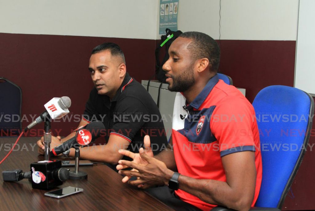 TT footballer Adrian Foncette (right) speaks to the media during a press conference at the Police Grounds, St James on Friday. Also in photo is TTFA communications manager Shaun Fuentes. PHOTO BY AYANNA KINSALE. - Ayanna Kinsale