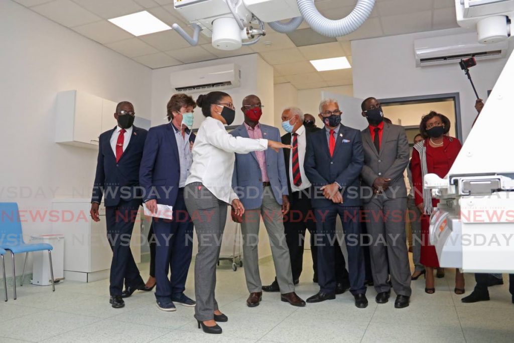 From left: Point Fortin MP Edmund Dillion, Consul of Austria Karl Pilstl, Prime Minister Keith Rowley, Minister of Health Terrence Deyalsingh, Mayor of Point Fortin Kennedy Richards tour the Point Fortin Hospital with Emily Carter, a biomedical engineer for Udecott on Saturday. - Marvin Hamilton
