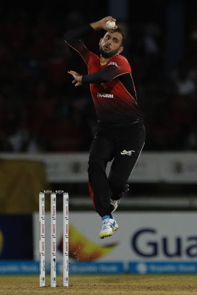 In this file photo provided by CPL T20, Fawad Ahmed of Trinbago Knight Riders bowls during a Hero Caribbean Premier League match against St Kitts and Nevis  Patriots, at the Queen’s Park Oval,  St Clair on August 11, 2018. - 