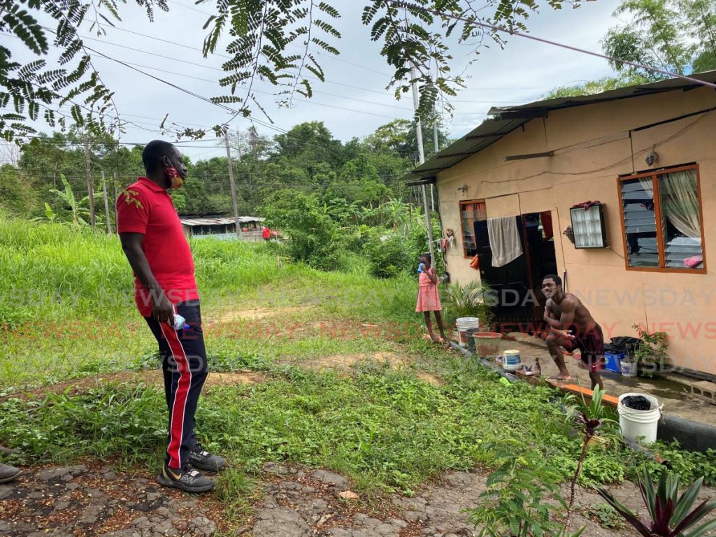 Point Fortin mayor and PNM candidate Kennedy Richards Jr speaks with a resident during a walkabout in Cochrane Village, Guapo in Point Fortin in July. - Narissa Fraser