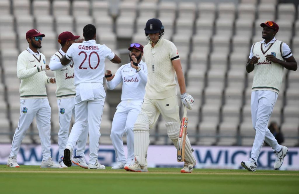 England's Dom Sibley, second right, leaves the field after being dismissed by West Indies' Shannon Gabriel, third left, during the first day of the first Test match between England and West Indies, at the Ageas Bowl in Southampton, England, on Wednesday. (via AP) - 