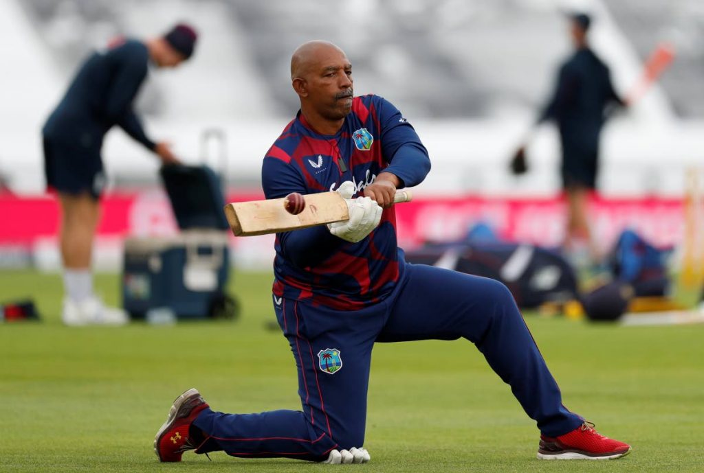 In this photo taken on Thursday, West Indies’ coach Phil Simmons helps players train before the start of play on the second day of the first Test between England and West Indies, at the Ageas Bowl in Southampton, England. via AP - 