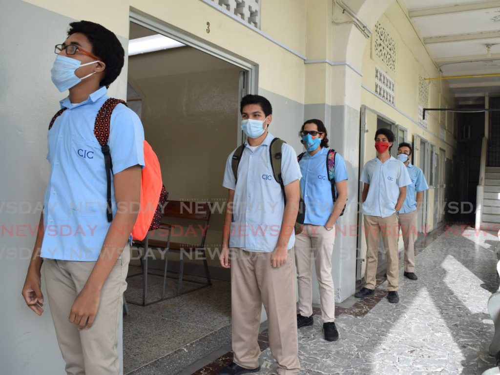 In this file photo, form six students of Saint Mary's College, CIC, Port of Spain, line up to enter a classroom. - Photo by Vidya Thurab