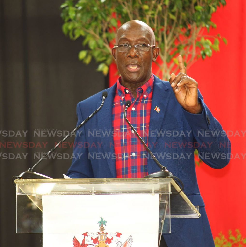 Prime Minister Dr Keith Rowley speaks at the launch of the Petrotrin land distribution at the Palo Seco Government Secondary School on Wednesday. - Lincoln Holder