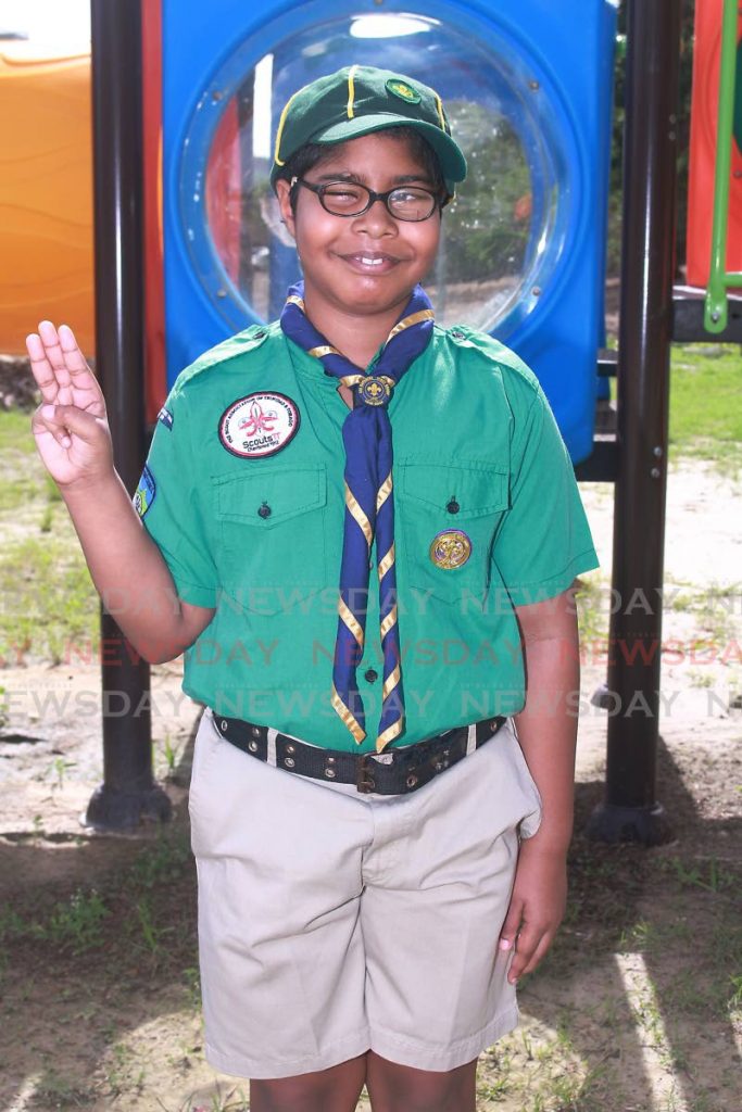 Kiran Lall takes his oath as a Cub Scout very seriously.  - 