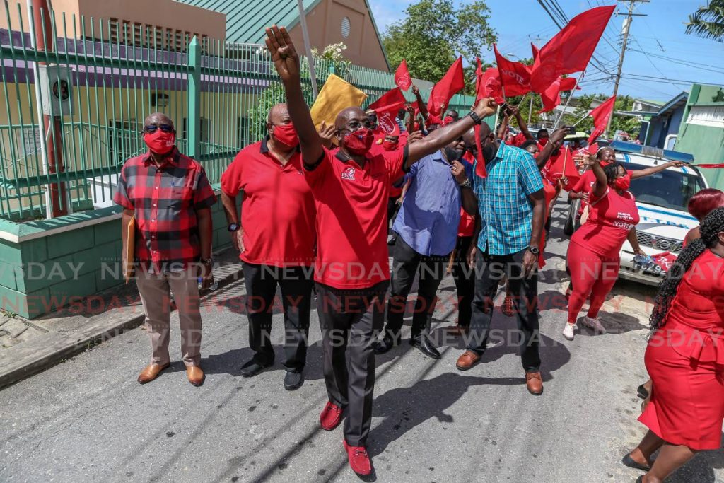 Prime Minister Dr Keith Rowley waves to supporters as he arrives to file nomination papers as the Diego Martin West candidate at Point Cumana Regional Complex on Friday. PHOTO BY JEFF MAYERS - 