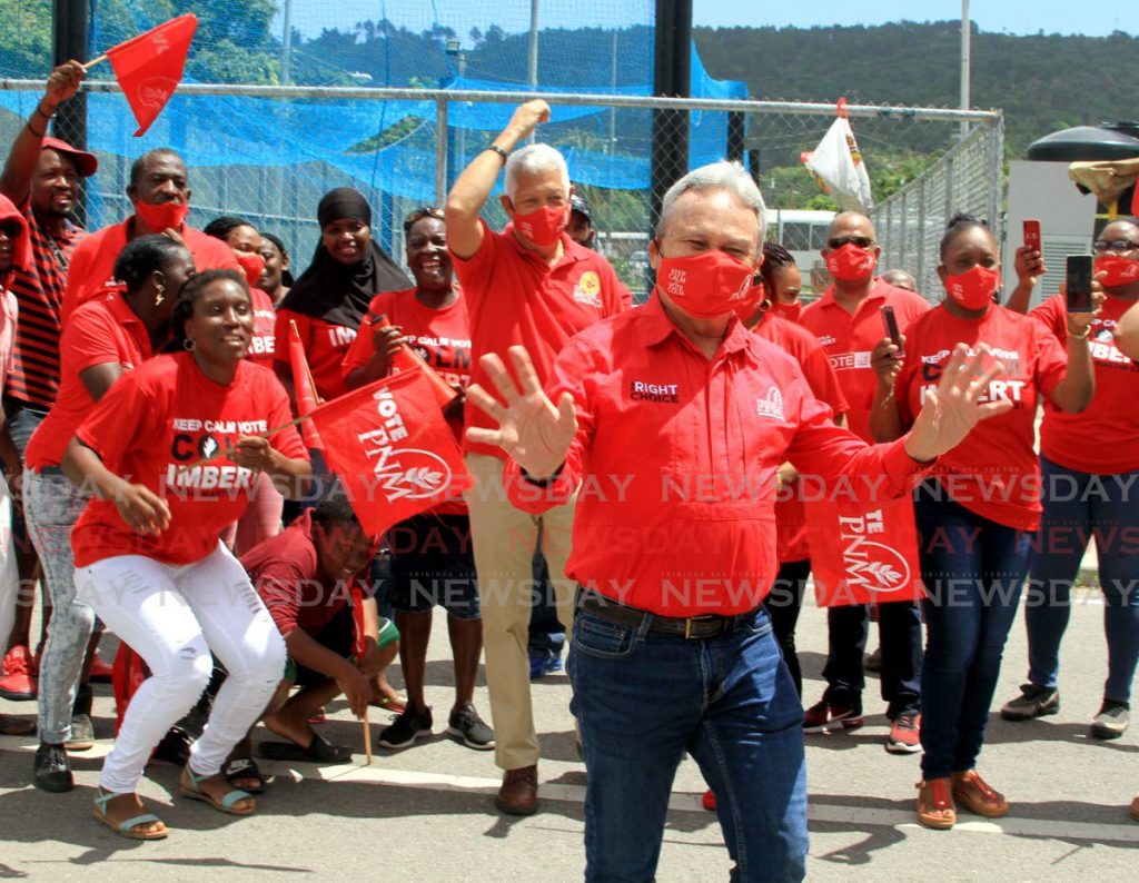 In this 2020 file photo Colm Imbert takes a photo with his supporters - Photo by Ayanna Kinsale