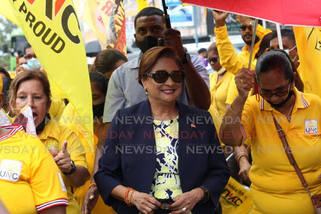 Political leader of the UNC Kamla Persad Bissessar leaving with her supporters after filing her nomination papers at the Elections and Boundaries office in Penal for the upcomming General Elections on August 10. - Lincoln Holder