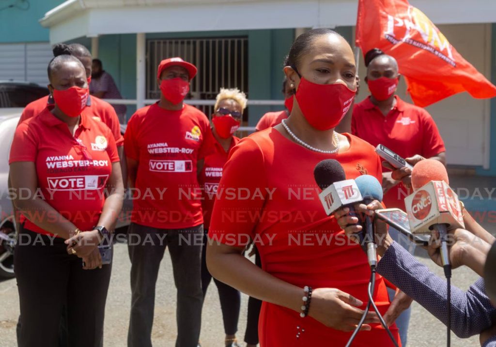 Ayanna Webster-Roy, accompanied by her family and supporters, speaks to media after filing nomination papers for Tobago East at the John Dial Community Centre on Friday. - David Reid