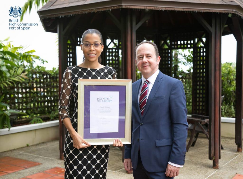 British High Commissioner Tim Stew (right) and Giselle Mendez, founder of the ‘Volunteer Centre of TT and 148th winner of the Commonwealth Points of Light award at the British High Commissioner's residence in Maraval on July 10. - Christopher Culpepper