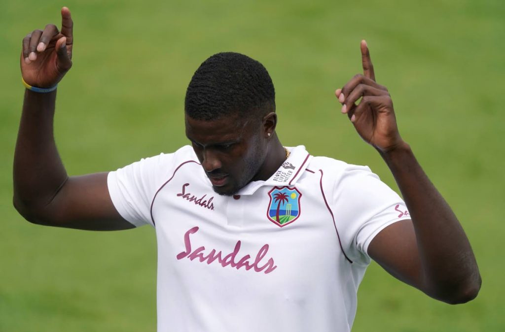 West Indies' captain Jason Holder gestures after a shot played by England's Ben Stokes on his delivery during the last day of the second cricket Test against England at Old Trafford in Manchester, England, on Monday. (AP Photo) - 