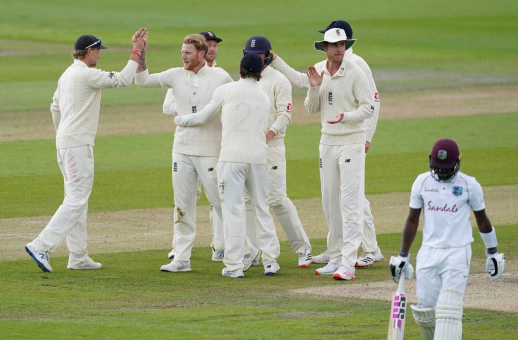 England's Ben Stokes (second left), celebrates with teammates the dismissal of West Indies' Jermaine Blackwood (right), during the last day of the second Test match between England and West Indies at Old Trafford in Manchester, England, on Monday. (AP PHOTO) - 