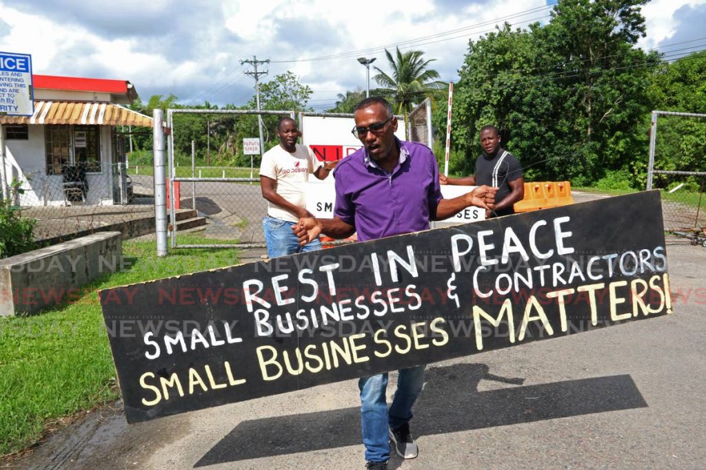 PROTEST: Contractor Alastai Ramharack leads protests on Monday in Golconda calling for Nidco to give contracts to small-scale local contractors for work on the Solomon Hochoy Highway extension. 
 - Marvin Hamilton