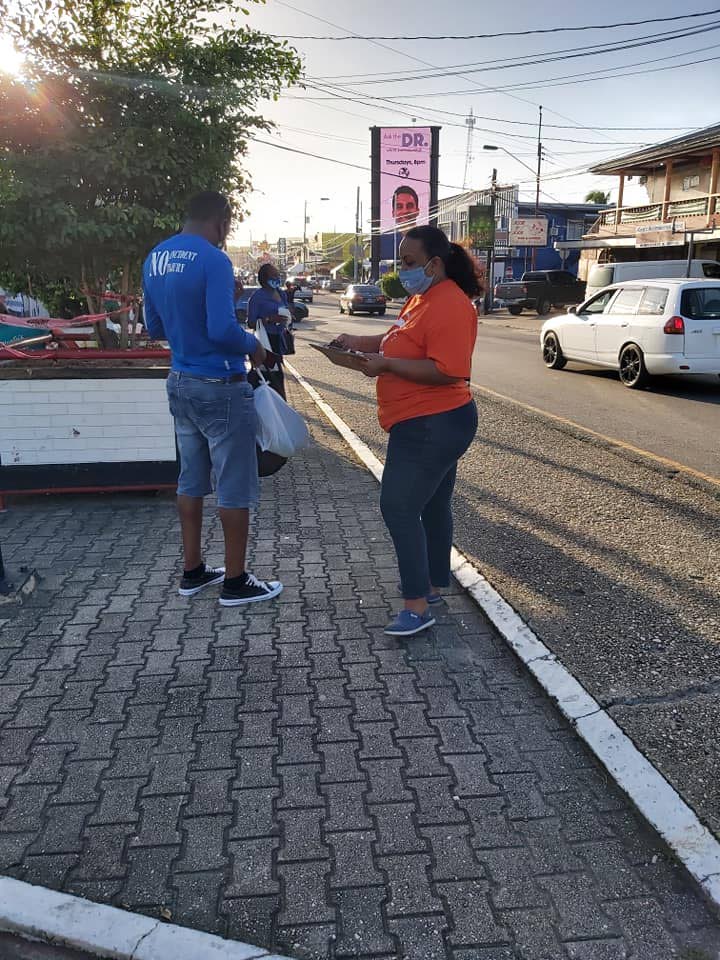 PEP candidate for Point Fortin Kenesha Ramsoondar speaks with a constituent during a walkabout. Photo via PEP Point Fortin Facebook page.  - 