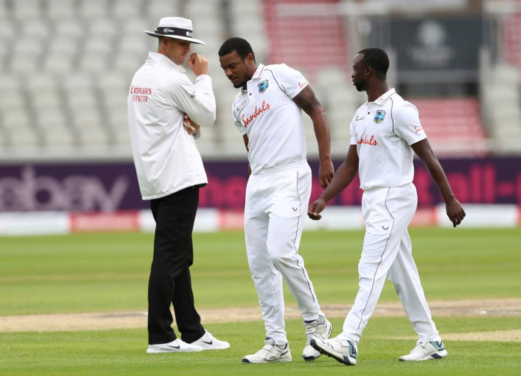 West Indies' Shannon Gabriel (centre), reacts as he walks off the field after bowling a delivery during the first day of the third Test match between England and West Indies at Old Trafford in Manchester, England, on Friday. (AP PHOTOS) - 