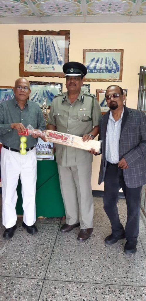 Deputy Commissioner of Prisons Mookish Pulliah, centre, with president of the TT Cricket Board Azim Bassarath, left, and Imtiaz Ali, Prisons Service Muslim chaplain at the presentation of cricket gear for inmates. - TT Cricket Board