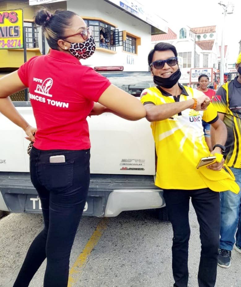 OPPOSING ELBOWS: UNC general election candidate for Princes Town Barry Padarath posted this photo on his Facebook page showing him greeting PNM candidate for that constituency, Sharon Baboolal, during his campaign walkabout on Sunday.  - 