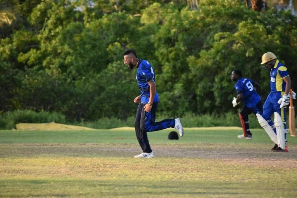 Police Cricket team bowler Rayad Emrit celebrates after getting the wicket of Amir Jangoo caught behind by Brian Christmas for one. PHOTO COURTESY CSL - CSL