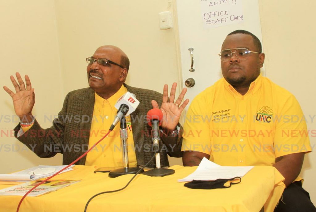 PNM TRICKS: Former UNC senator Wade Mark makes a point on Tuesday during a press conference in Port of Spain in support of the party’s PoS North/West candidate Darren Garner, right. 
 - Ayanna Kinsale