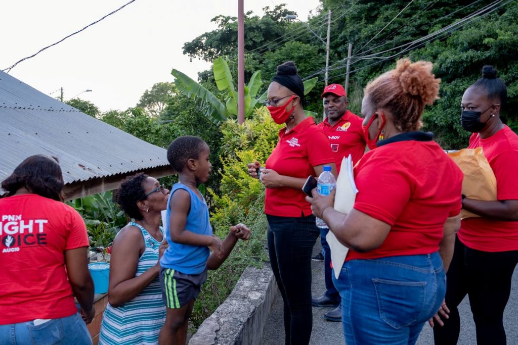 PNM Tobago East MP-elect Ayanna Webster-Roy chats with residents of Mt St George during a walkabout before the general election.  - 
