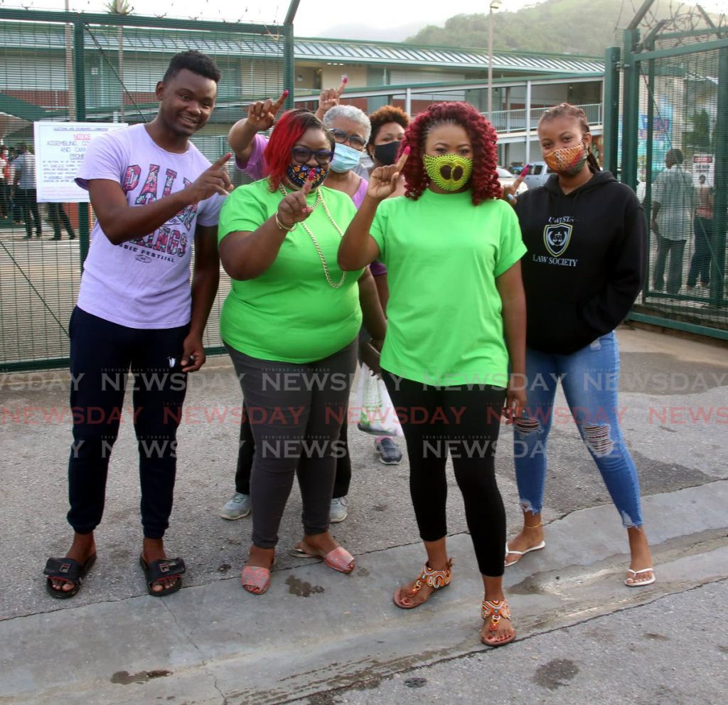 Dr Nyan Gadsby-Dolly (second from right)  and friends after voting early at the Febeau Government Primary School in San Juan. - SUREASH CHOLAI