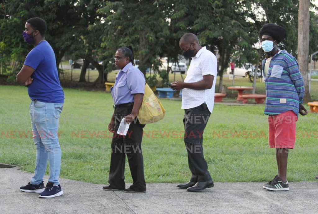 PNM's La Horquetta/Talparo candidate Foster Cummings stands in line to vote at the Couva South Government Primary School on Monday morning. - Angelo Marcelle