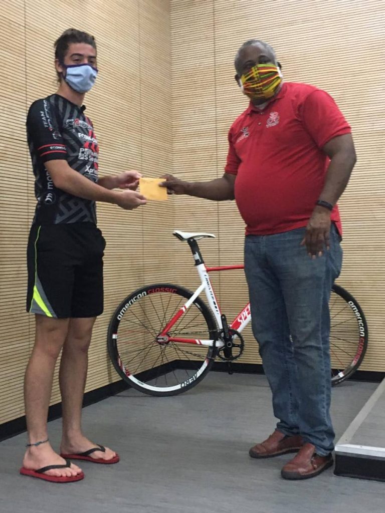 TTCF president Joseph Roberts, right, present Raiders representative Liam Trepte with his winnings from the inaugural Virtual Time Trial Cycling event.  - 