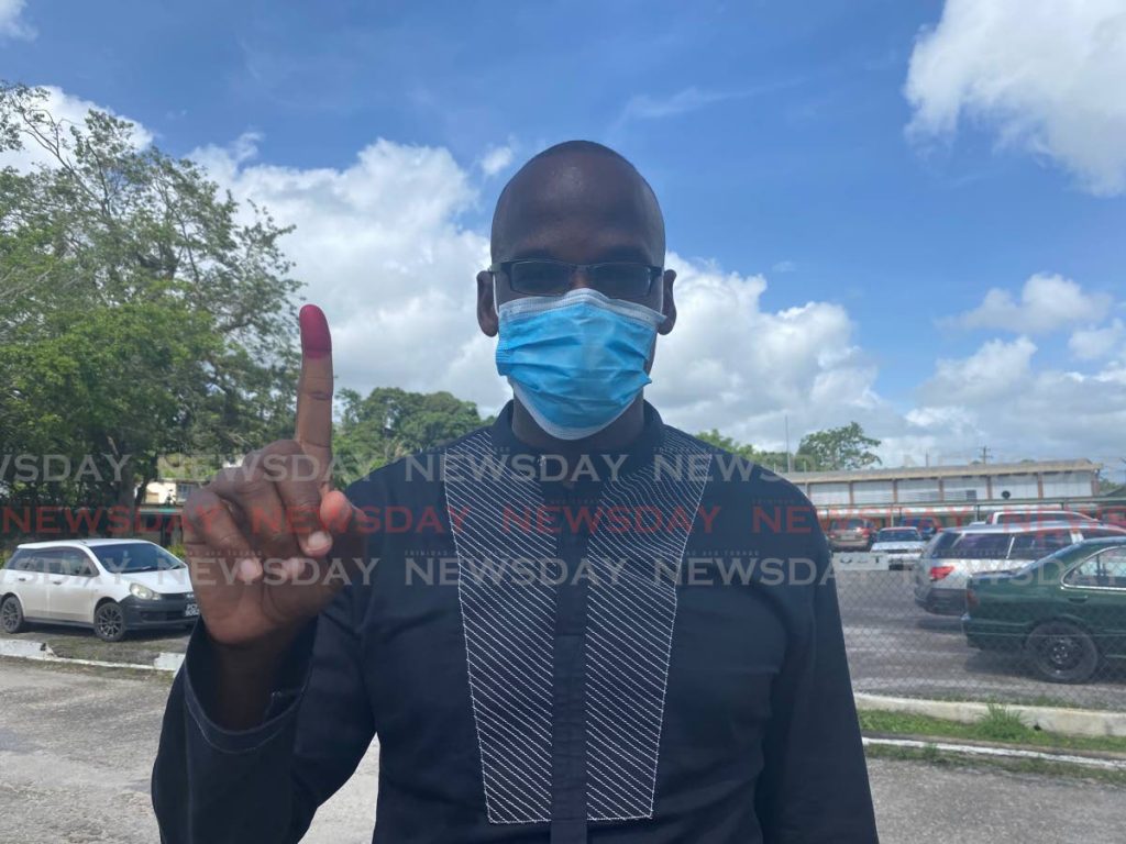 UNC candidate for Point Fortin Taharqa Obika voted at the Point Fortin East Secondary School on Monday morning. - 