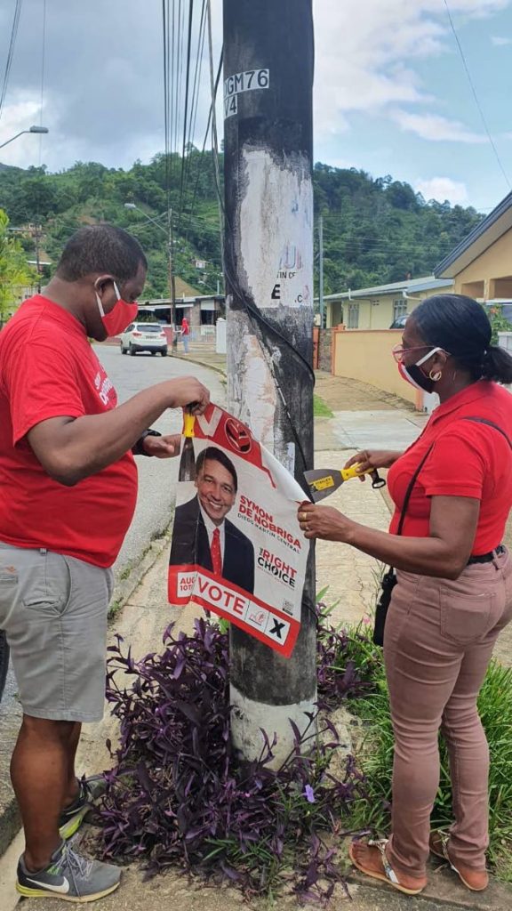 PNM MP-elect Symon de Nobriga was out removing campaign posters from within the Diego Martin Central constituency with members of his team earlier on Tuesday. - Courtesy Symon de Nobriga 