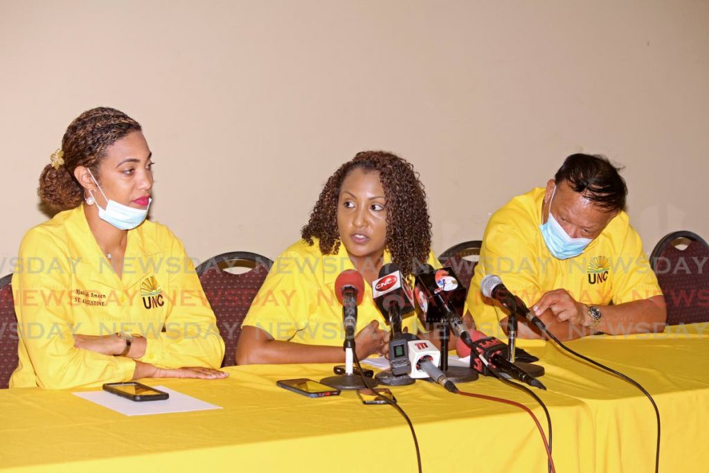 SOMEONE’S MISSING:
 UNC PRO Anita Haynes, centre, speaks to media as executive members Khadijah Ameen and David Lee look on at a UNC press conference at the M Rampersad 
Building, Rushworth Street, San Fernando, on Tuesday.  - CHEQUANA WHEELER