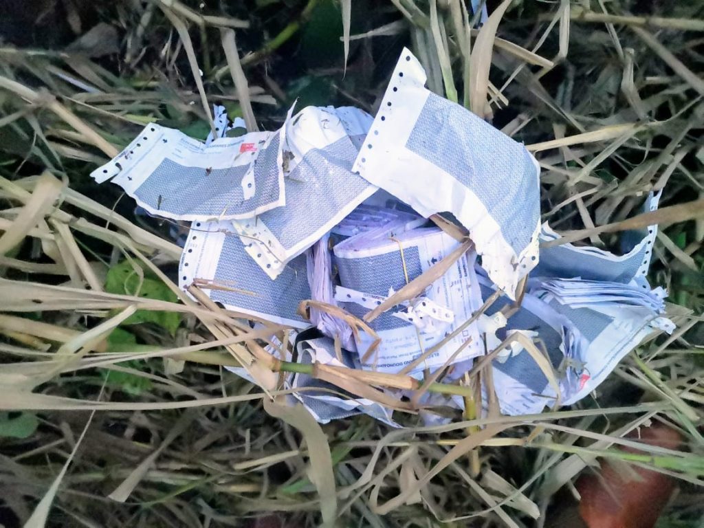DUMPED: The polling cards found dumped in Pinto Road, Arima which is now the subject of a police investigation. - 