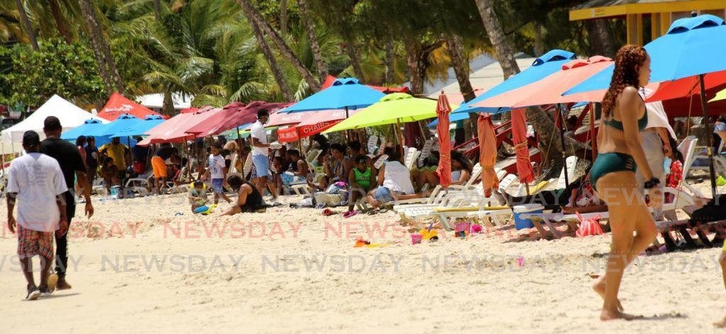 LAST DIP: 
Hundreds flocked to Maracas Beach on Sunday to take a last dip in the water before beaches remain close for the next 28 days as part of new covid19 measures announced by the Prime Minister. PHOTO BY SUREASH CHOLAI - SUREASH CHOLAI