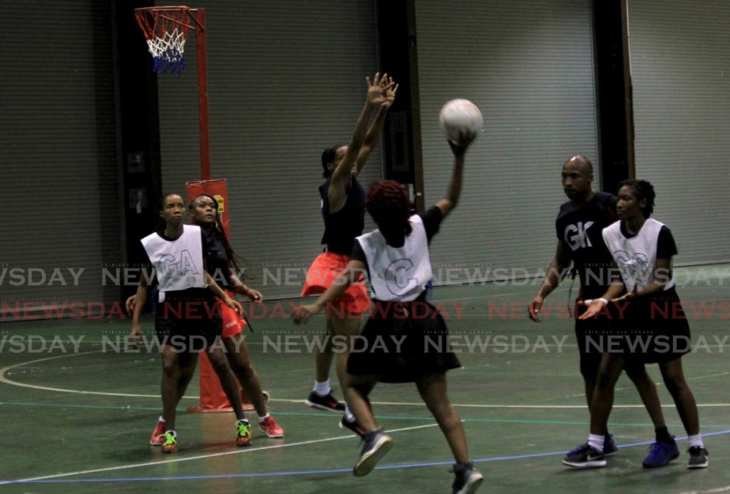 Fire’s Anika McKenna attempts to score against team TSTT during the Courts All Sectors Netball League knock-out game, at Centre of Excellence, Macoya,on Saturday. - Ayanna Kinsale
