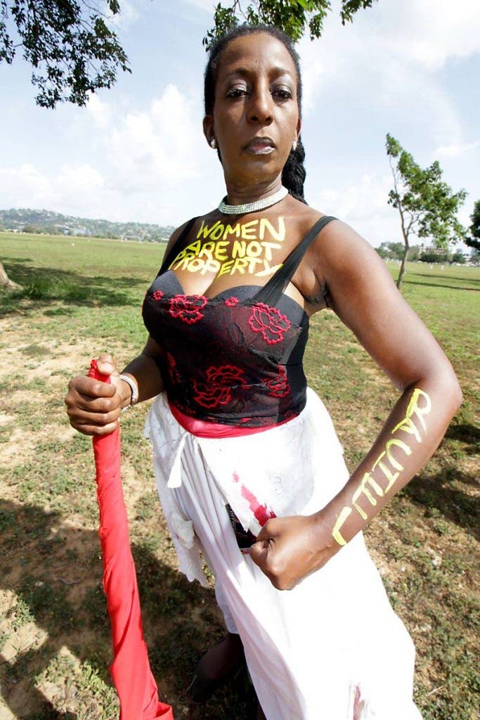 Leah Gordon has the words “Women Are Not Property” written across her chest during the International Women’s Day Walk at Queen’s Park Savannah, Port of Spain in March 2018. - 