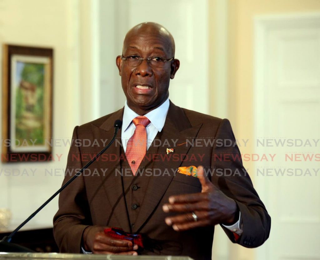 Prime Minister Dr Keith Rowley addresses the media after he and his Cabinet were sworn in at President's House, St Ann's on Wednesday. - SUREASH CHOLAI