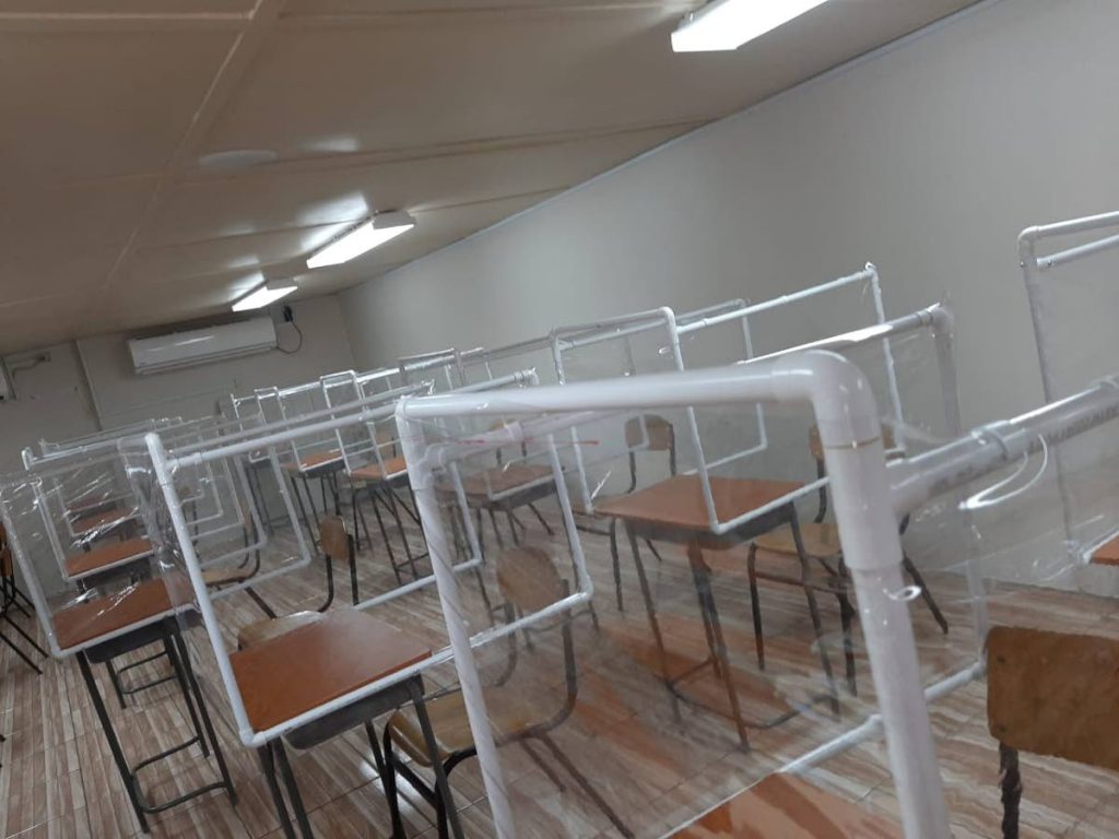 PTA and staff members built protective barriers on to chairs and desks at Moruga RC Primary School. - 