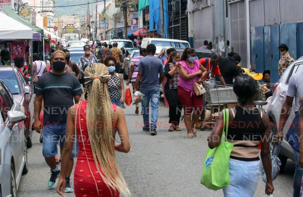 In this file photo, masked shoppers crowd Charlotte Street, Port of Spain. Photo by Sureash Cholai