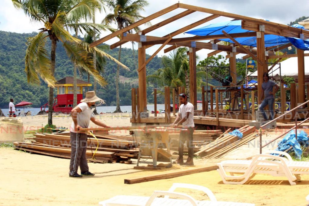 While beaches remain closed workmen construct dining decks on Marcas beach in August.  Photo: Sureash Cholai