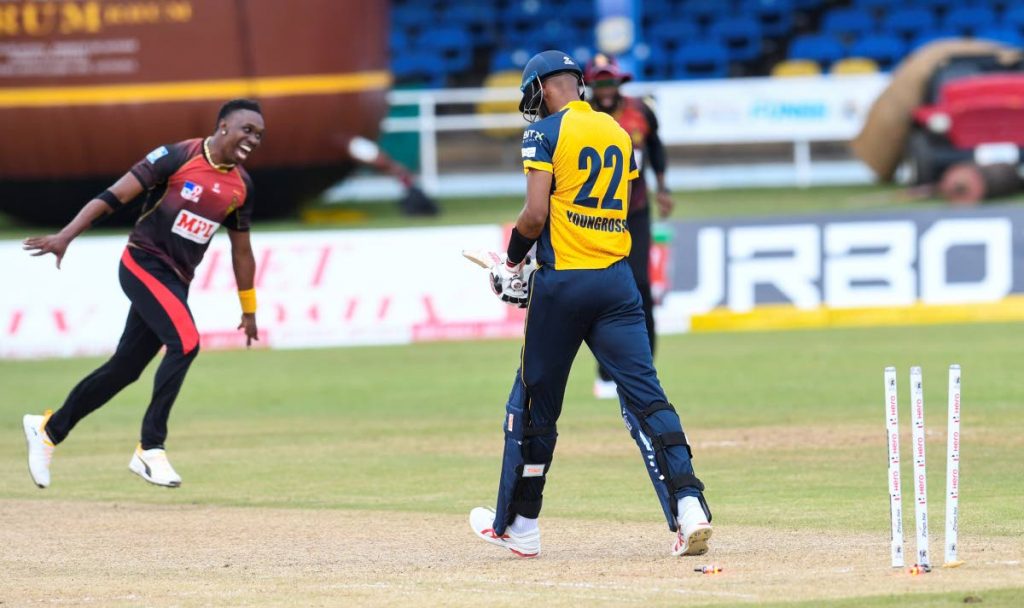 Roston Chase (R) of St Lucia Zouks is dismissed by Dwayne Bravo (L) of Trinbago Knight Riders during the Hero Caribbean Premier League match 13 between St Lucia Zouks and Trinbago Knight Riders at Queen's Park Oval on Wednesday. - CPL T20 via Getty Images