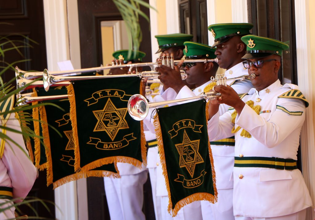 Members of the Defence Force play the presidential fanfare on the arrival of the President.

Photo courtesy Parliament TT