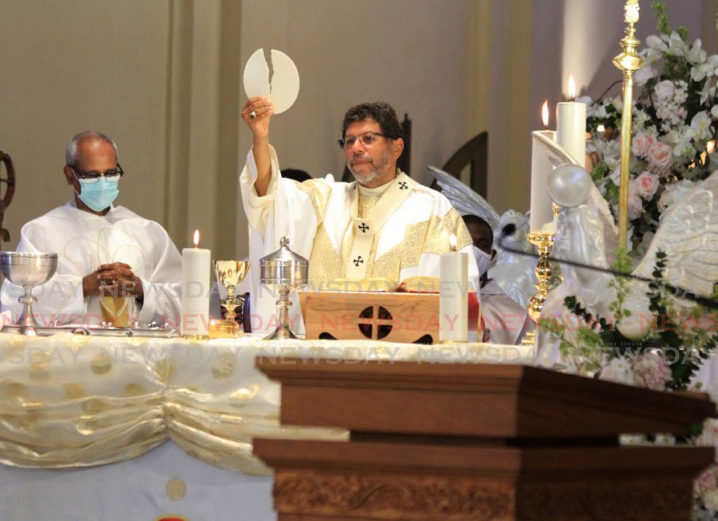 In this June 11, 2020 file photo RC Archbishop Jason Gordon officiates at Corpus Christi mass, Cathedral of the Immaculate Conception. Gordon in a video message announced there will be no confirmation ceremonies in 2020 due to covid19. Photo by Ayanna Kinsale