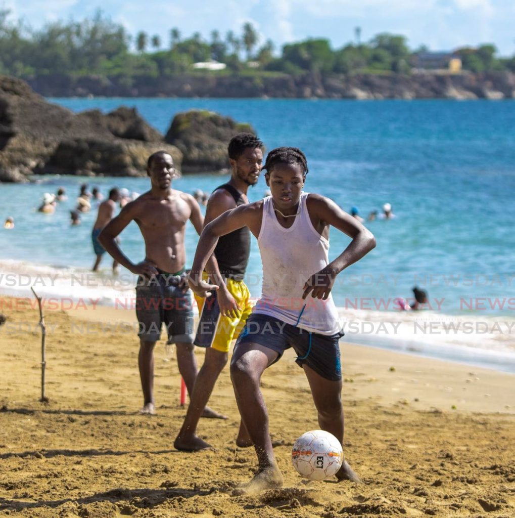 In this July 26 file photo, friends enjoy a game of football at Mt Irvine beach, Tobago. Beaches will once again close from Monday as new measures to control a second wave of covid19 take effect. - DAVID REID 