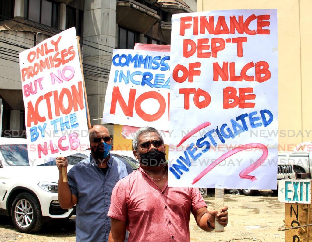 Members of the Lotto Agents Association protest outside the National Lotteries Board, Port of Spain on Thursday. PHOTO BY AYANNA KINSALE - 