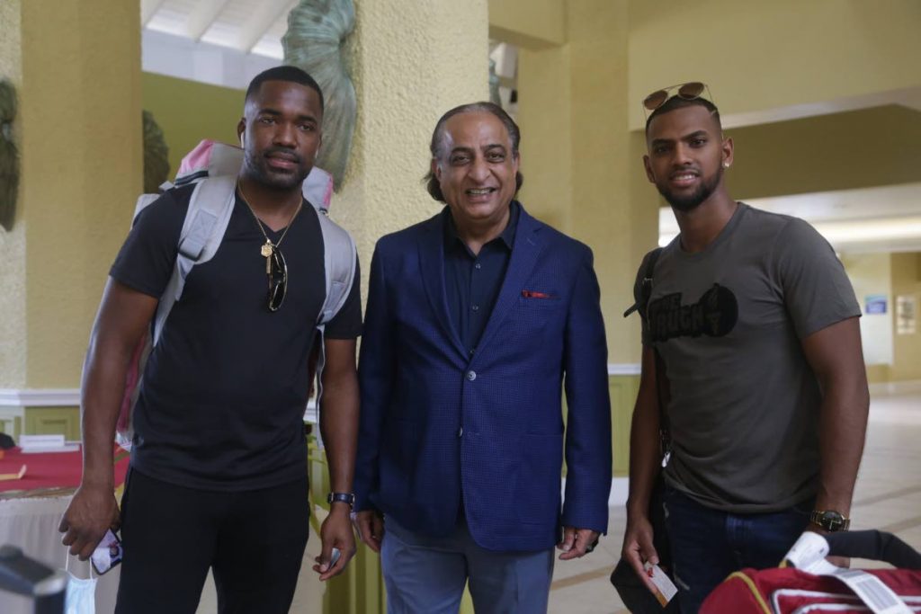 Magdalenda Grand Beach & Golf Resort general manager Vinod Bajaj, centre, with Trinidadian cricketers Darren Bravo, left, and Nicholas Pooran at the hotel on Friday. PHOTO COURTESY OFFICE OF CHIEF SECRETARY - 