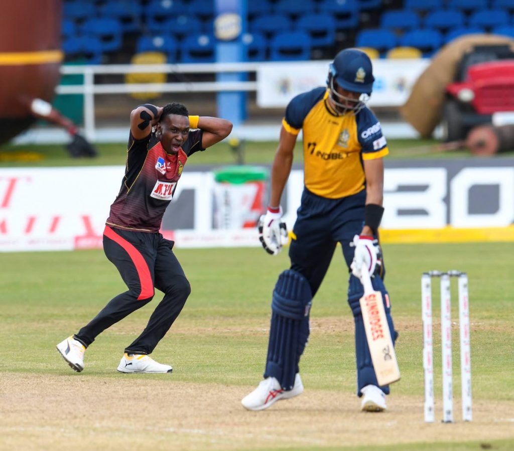  Dwayne Bravo (L) of Trinbago Knight Riders expresses disappointment after Roston Chase (R) of St Lucia Zouks is not caught behind during the Hero Caribbean Premier League match 13 between St Lucia Zouks and Trinbago Knight Riders at Queen’s Park Oval, St Clair, last Wednesday.  - CPL T20 via Getty Images