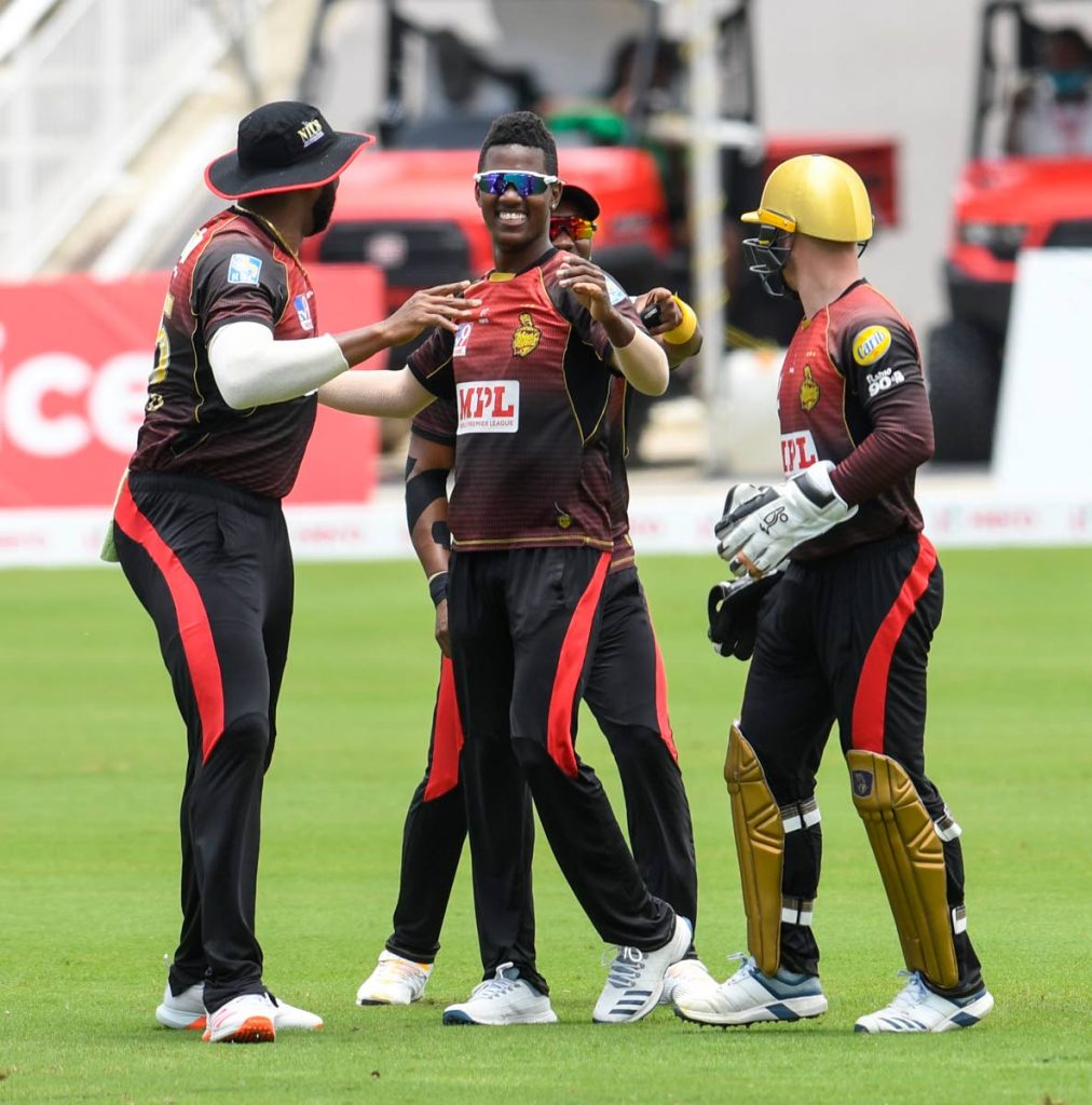 Akeal Hosein (C), of Trinbago Knight Riders, celebrates the dismissal of Chadwick Walton, of Jamaica Tallawahs, during the Hero Caribbean Premier League match between Jamaica Tallawahs and Trinbago Knight Riders, at Brian Lara Cricket Academy on Tuesday. - CPL T20 via Getty Images